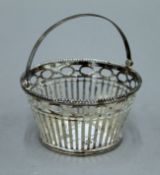 A small Continental silver basket. 9 cm diameter.