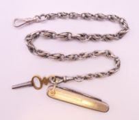 A silver watch chain, key and penknife. Chain 32 cm long, penknife 5 cm long.