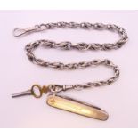 A silver watch chain, key and penknife. Chain 32 cm long, penknife 5 cm long.