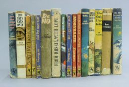 A box of Ian Fleming books and others.