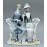 A Lladro figural group.