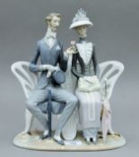 A Lladro figural group.