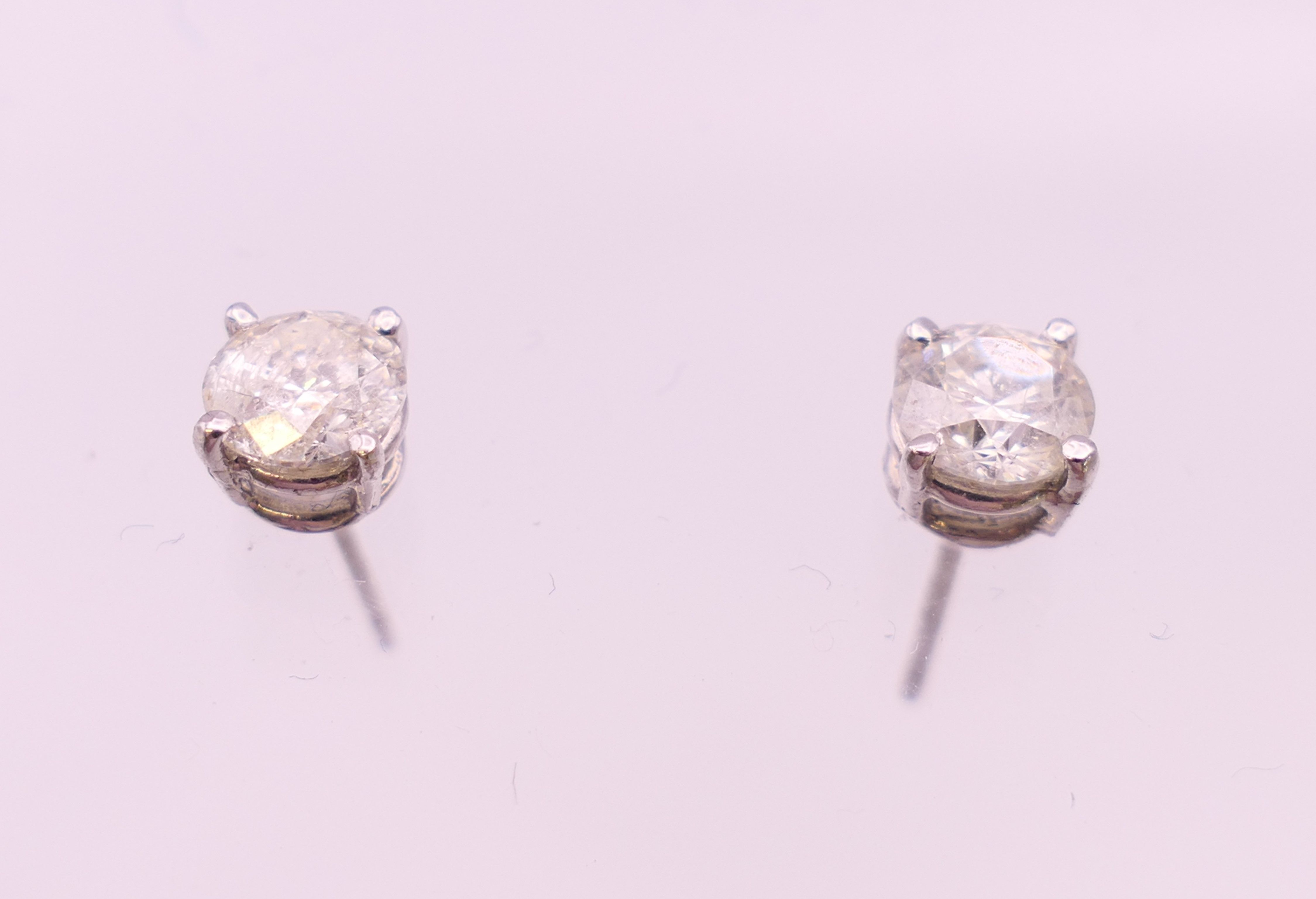 A pair of 18 ct white gold diamond stud earrings. Total diamond weight approximately 1.1 carats. - Image 2 of 5
