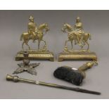 A pair of brass mantelpiece ornaments formed as King George V and Queen Mary (each 22 cm high),