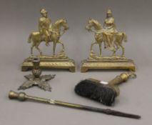 A pair of brass mantelpiece ornaments formed as King George V and Queen Mary (each 22 cm high),