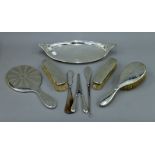 A silver dressing table set, a silver tray, etc.