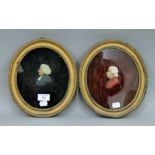 Two 19th century oval framed wax profile portraits. 25 x 22 cm overall.