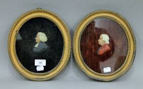 Two 19th century oval framed wax profile portraits. 25 x 22 cm overall.