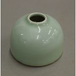 A small Chinese celadon ink pot. 4.5 cm high.