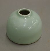 A small Chinese celadon ink pot. 4.5 cm high.