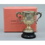 A small boxed Garrard & Co silver trophy cup. 9 cm high. 173.1 grammes.