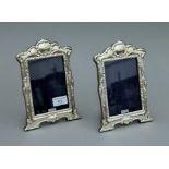 A pair of silver photograph frames. 21 cm high.