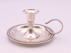 A sterling silver chamber stick. 4.25 cm high.