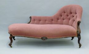 A Victorian button upholstered chaise lounge. Approximately 175 cm long.