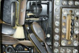 A box of antique ebony items.