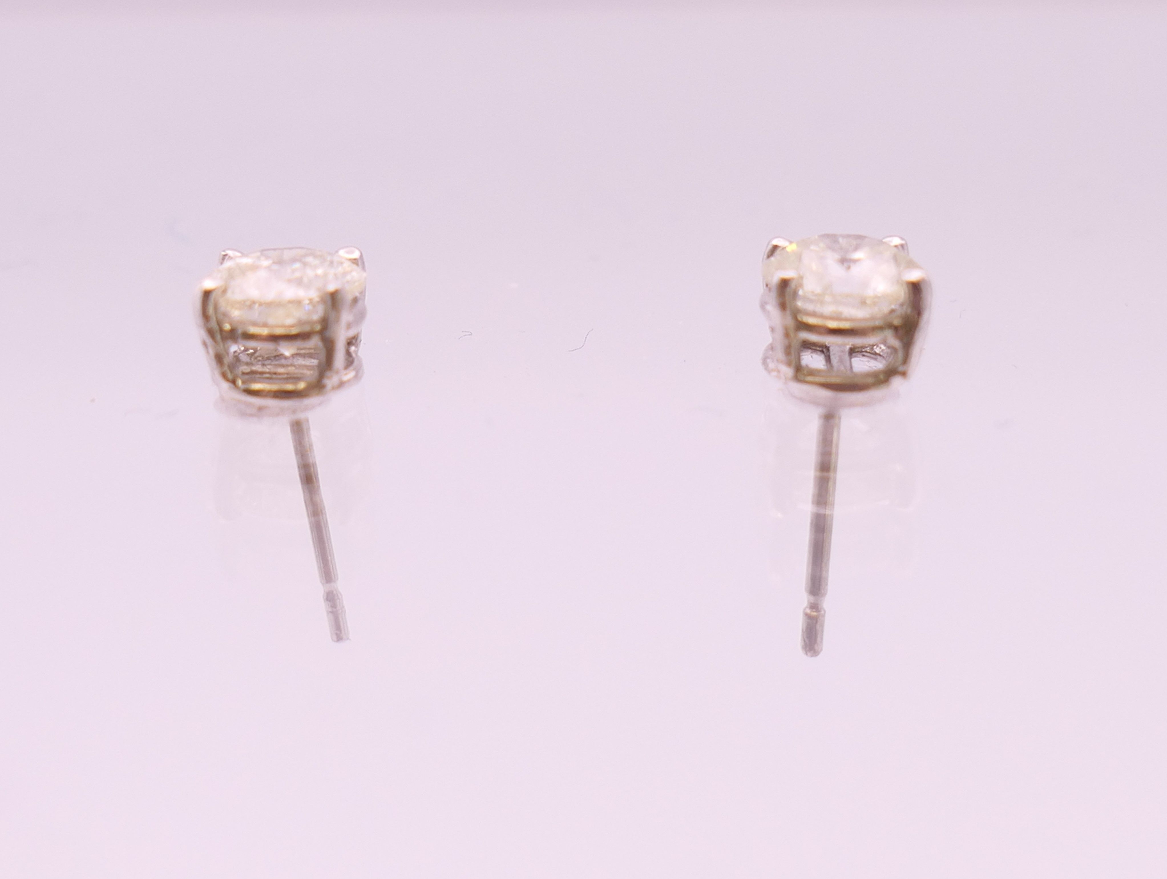 A pair of 18 ct white gold diamond stud earrings. Total diamond weight approximately 1.1 carats. - Image 3 of 5