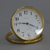 A Tiffany desk clock. 9 cm diameter.