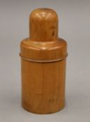 A 19th century treen meerschaum pipe and a treen bottle case. The latter 15 cm high.