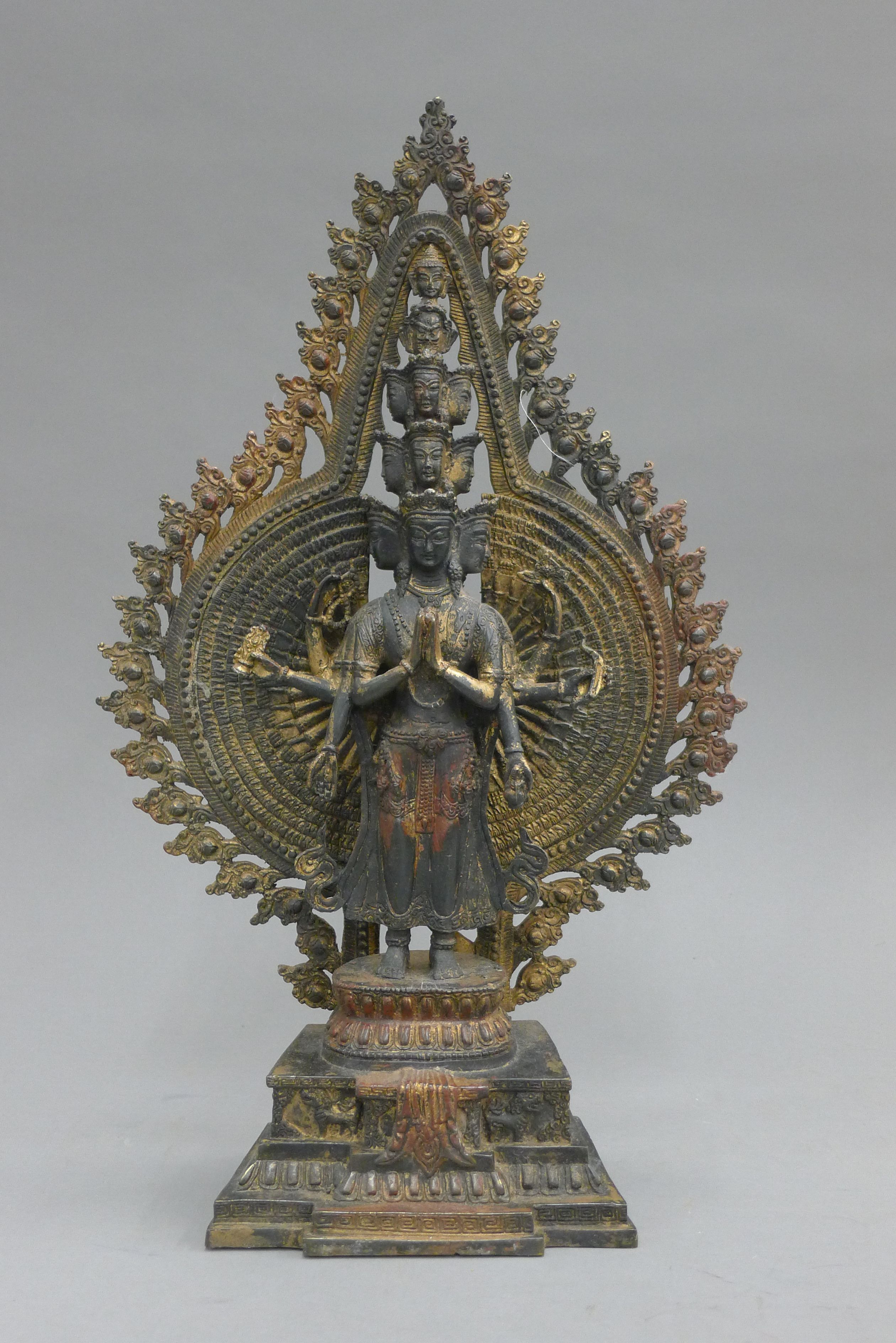 A bronze model of a multi-armed deity. 40.5 cm high.