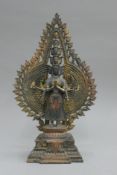 A bronze model of a multi-armed deity. 40.5 cm high.