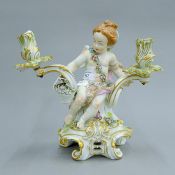 A Continental porcelain candelabra. 26.5 cm high.