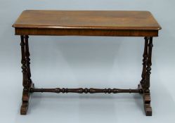 A Victorian walnut side table. 105 cm long, 72 cm high, 50 cm deep.