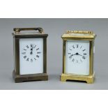 Two brass cased carriage clocks. Each approximately 15 cm high overall.