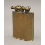A large vintage brass table lighter. 10 cm high.