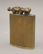 A large vintage brass table lighter. 10 cm high.