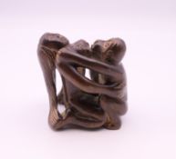 An erotic wooden netsuke. 4.5 cm high.