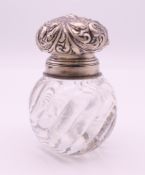 A silver top embossed inkwell. 8 cm high.