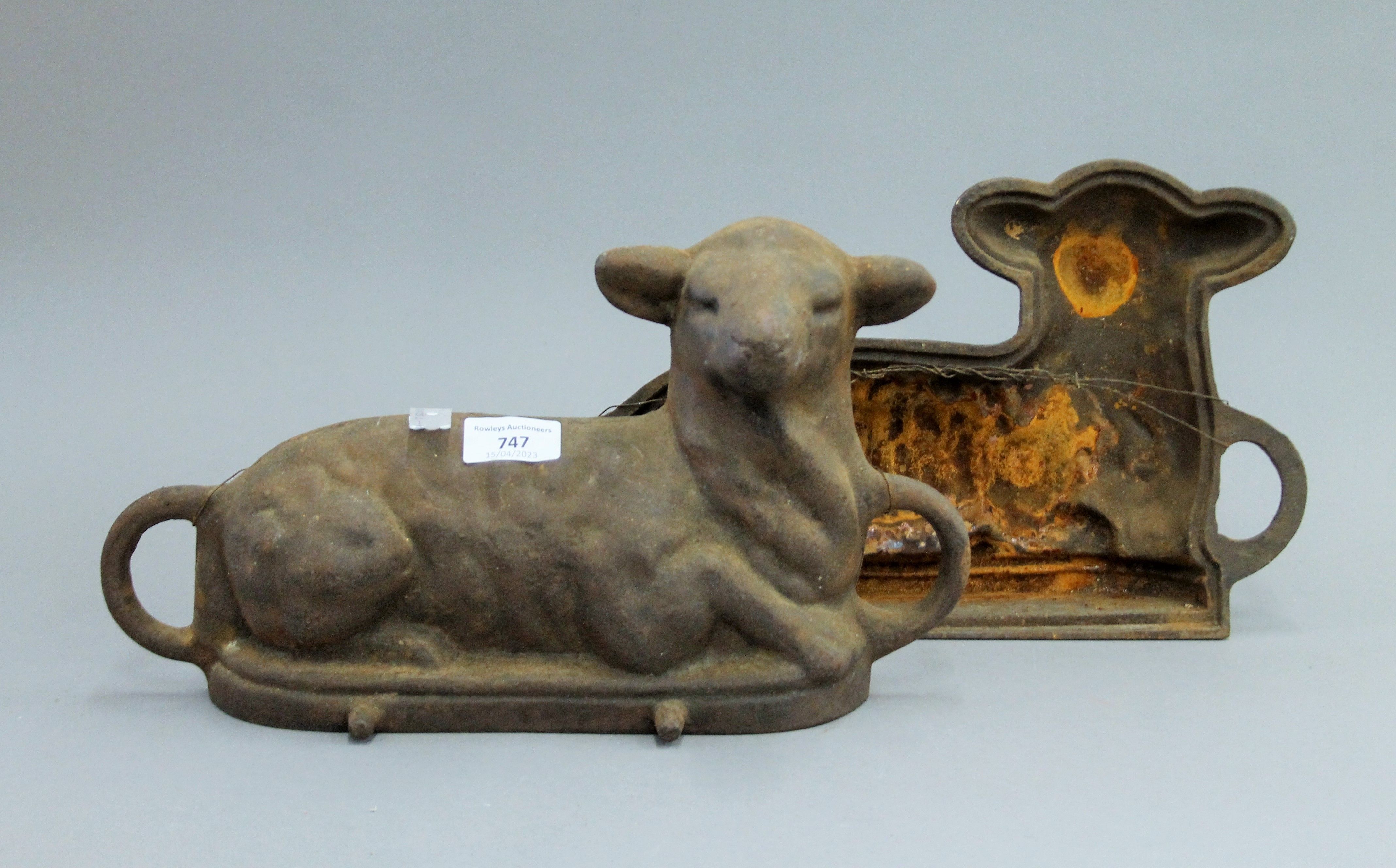 A cast iron chocolate mould formed as a lamb. 35 cm long.