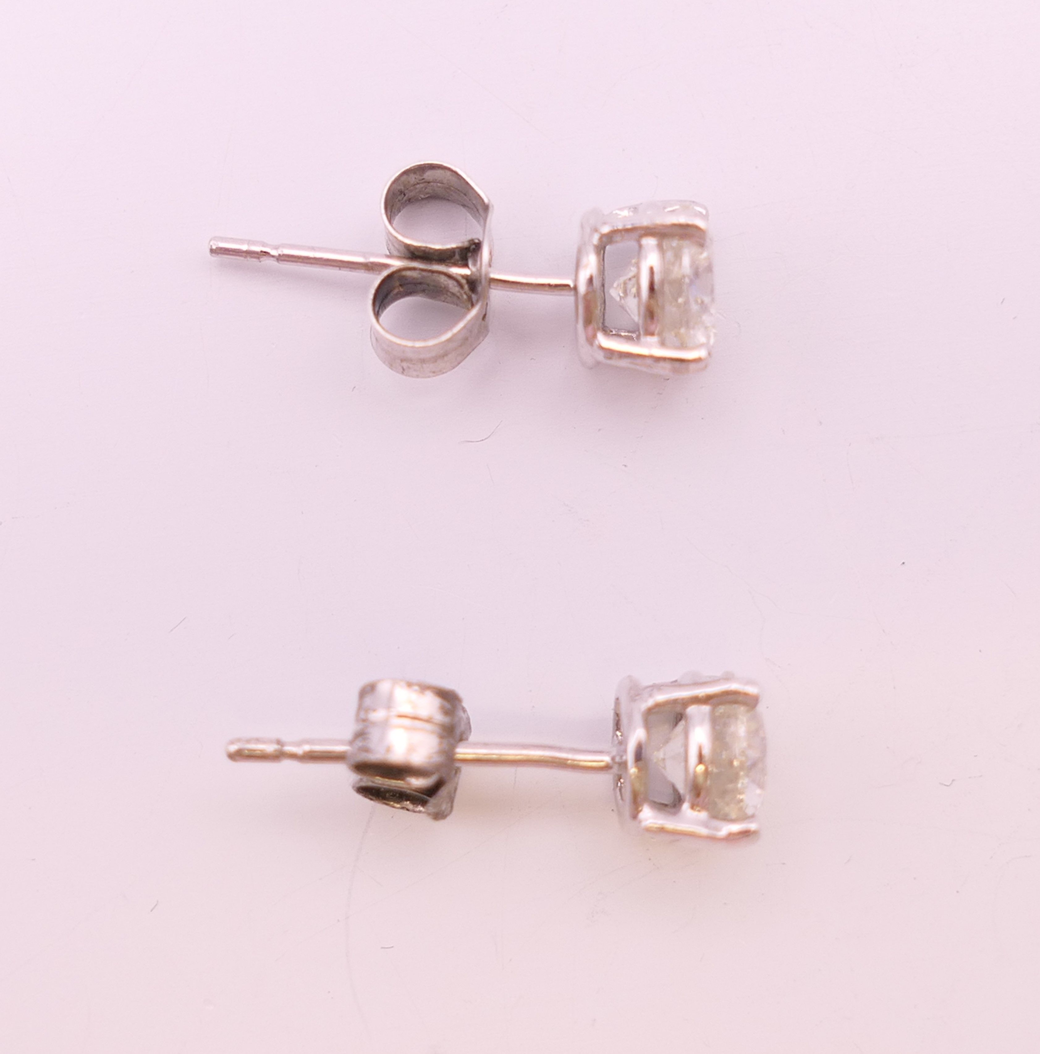 A pair of 18 ct white gold diamond stud earrings. Total diamond weight approximately 1.1 carats. - Image 4 of 5