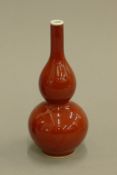 A small Chinese red porcelain double gourd vase. 17 cm high.