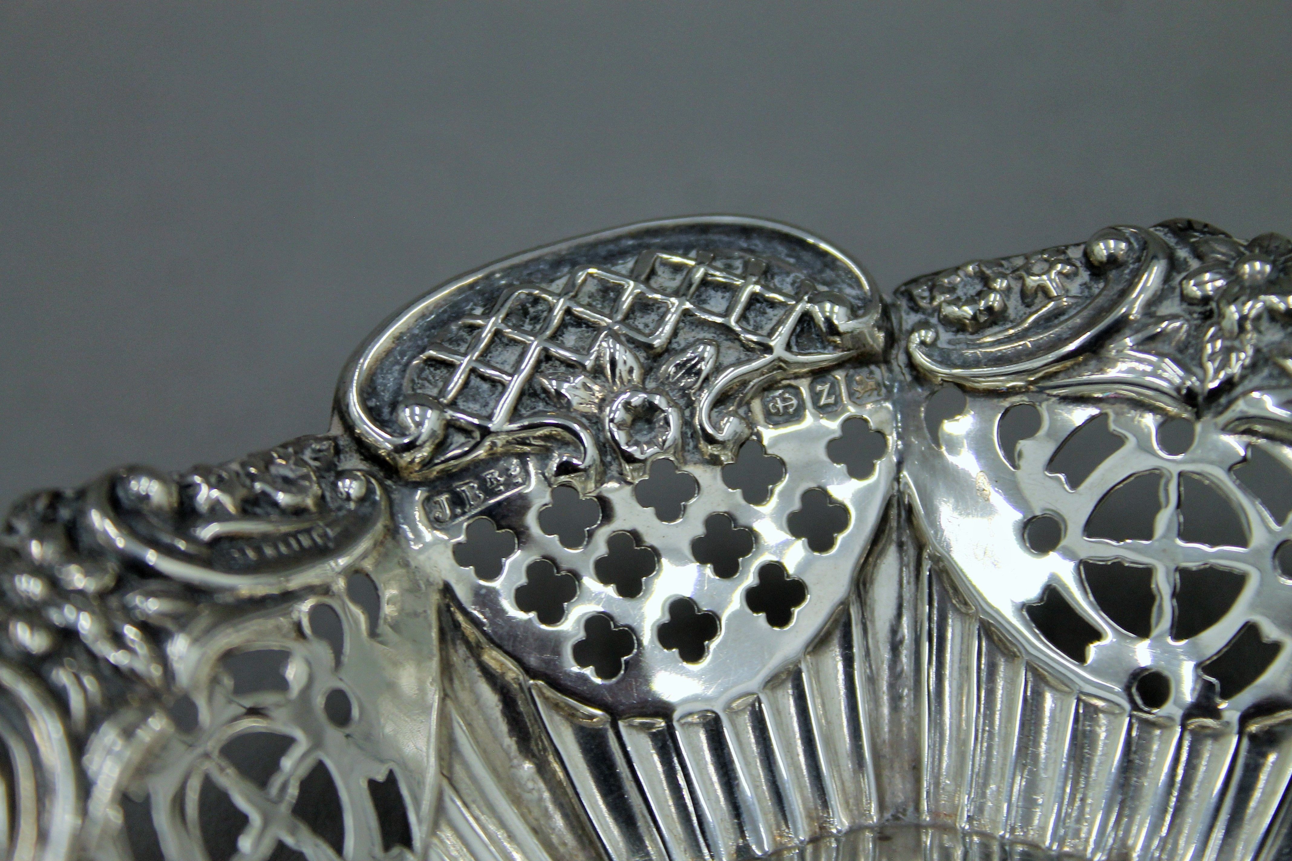 A pair of silver bon bon dishes, hallmarked for Birmingham 1899 and a pair of bottle coasters. - Image 3 of 5