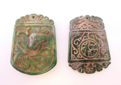 Two jade pendants. Each 5.5 cm high.