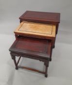 A nest of three Chinese tables. 71 cm wide.