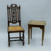 Two 19th century carved oak chairs and a side table. The latter 48 cm long.