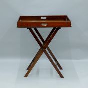 A Victorian mahogany butler's tray on stand. 72 cm wide.