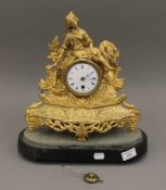 A 19th century ormolu clock and stand. 37 cm high.