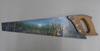 A saw painted with a stag. 64 cm long.