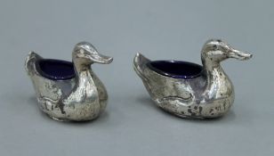 A pair of duck form silver salts. 10 cm long.