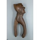 A late 19th/early 20th century figural carved nut cracker. 22 cm high.