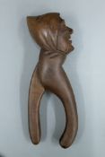 A late 19th/early 20th century figural carved nut cracker. 22 cm high.