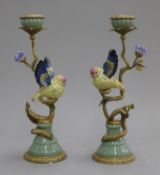 A pair of porcelain and gilt metal bird form candlesticks. 33 cm high.