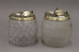 Two silver plated mounted glass biscuit barrels. The largest 18 cm high.