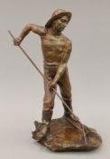 A late 19th century French bronze sculpture of a Shrimper in working costume,