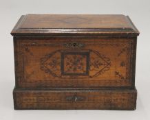 An 18th century Indo-Portuguese spice box with inlaid decoration. 42 cm wide.