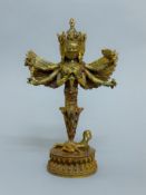 A bronze model of a multi-armed deity. 27.5 cm high.