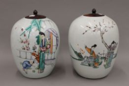 Two late 19th/early 20th century Chinese ovoid porcelain vases, with wooden lids.